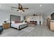 Oversized main bedroom with several sitting areas, ceiling fan, and an open floor plan at 6419 Eldora Ave, Las Vegas, NV 89146