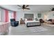 Open main bedroom suite offering several sitting areas, ceiling fan, and neutral decor at 6419 Eldora Ave, Las Vegas, NV 89146
