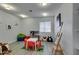 Bright playroom with plenty of natural light, an easel, and a play kitchen at 6419 Eldora Ave, Las Vegas, NV 89146