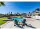 Private pool with a hot tub, well-maintained lawn, patio seating, and string lights at 6419 Eldora Ave, Las Vegas, NV 89146