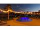 Inviting backyard pool and spa, surrounded by an illuminated string of backyard lights for evening fun at 6419 Eldora Ave, Las Vegas, NV 89146