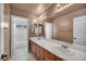 Bathroom featuring a double vanity, white counters, and tiled floors at 6424 Grayback Dr, North Las Vegas, NV 89084