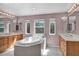 Light and bright bathroom features soaking tub, dual sinks and natural light at 6424 Grayback Dr, North Las Vegas, NV 89084