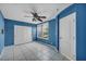 Bedroom showcasing tile flooring, a ceiling fan, closet, and natural light at 6424 Grayback Dr, North Las Vegas, NV 89084