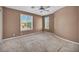 Neutral bedroom with two windows offering natural light at 6424 Grayback Dr, North Las Vegas, NV 89084