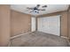 Neutral bedroom with a ceiling fan and closet with sliding doors at 6424 Grayback Dr, North Las Vegas, NV 89084