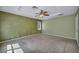 Bedroom with carpeted flooring, ceiling fan, and window providing natural light at 6424 Grayback Dr, North Las Vegas, NV 89084