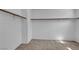 A walk-in closet with carpeted floors and built in shelves at 6424 Grayback Dr, North Las Vegas, NV 89084