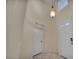 Bright entryway featuring high ceilings and decorative lighting at 6424 Grayback Dr, North Las Vegas, NV 89084