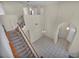 Bright entryway featuring tiled floors, staircase, and an elegant chandelier at 6424 Grayback Dr, North Las Vegas, NV 89084
