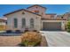 Well-maintained two-story home with two-car garage and arched windows at 6424 Grayback Dr, North Las Vegas, NV 89084