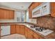 Bright kitchen featuring granite countertops, modern appliances, and gas cooktop at 6424 Grayback Dr, North Las Vegas, NV 89084