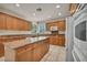 Traditional kitchen boasts granite countertops, center island, and appliances at 6424 Grayback Dr, North Las Vegas, NV 89084