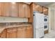 Updated kitchen features granite countertops, stainless appliances, and cabinetry at 6424 Grayback Dr, North Las Vegas, NV 89084