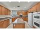 Updated kitchen featuring granite countertops, an island, and stainless appliances at 6424 Grayback Dr, North Las Vegas, NV 89084