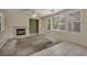 Cozy living room featuring a fireplace and bright windows at 6424 Grayback Dr, North Las Vegas, NV 89084
