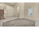 Spacious living room features high ceilings, tile flooring, and a staircase leading to the upper level at 6424 Grayback Dr, North Las Vegas, NV 89084