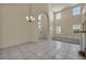 This spacious living area showcases soaring ceilings and large windows, creating an open and airy ambiance at 6424 Grayback Dr, North Las Vegas, NV 89084