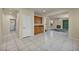Open-concept area featuring access to the living room with fireplace, and a door at 6424 Grayback Dr, North Las Vegas, NV 89084