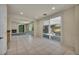 Bright living area featuring sliding glass doors, and living room with fireplace at 6424 Grayback Dr, North Las Vegas, NV 89084