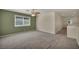 Spacious loft with carpeted floor and a window providing natural light at 6424 Grayback Dr, North Las Vegas, NV 89084