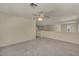 Open loft area with carpeted floors and abundant natural light at 6424 Grayback Dr, North Las Vegas, NV 89084