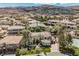 Expansive aerial view showcases the lush landscaping, tennis court, and well-manicured grounds of this beautiful estate at 764 Ricota Ct, Henderson, NV 89012