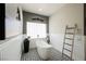 Bright bathroom with a modern standalone tub and stylish black and white tile at 764 Ricota Ct, Henderson, NV 89012