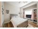 Cozy bedroom with a plush bed, built-in shelving, and soft natural light at 764 Ricota Ct, Henderson, NV 89012