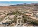 Grand community entrance with palm trees, lush landscaping, and a cascading waterfall feature at 764 Ricota Ct, Henderson, NV 89012