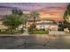 Beautiful home featuring manicured lawn, palm trees, decorative stone walkway and two car garage at 764 Ricota Ct, Henderson, NV 89012