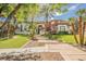 Beautiful single-Gathering home with lush lawn, mature palm trees, and a stone walkway to the front door at 764 Ricota Ct, Henderson, NV 89012