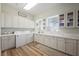 Spacious laundry room with plenty of storage and counter space and natural light at 764 Ricota Ct, Henderson, NV 89012