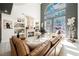 Bright, open-concept living room with fireplace, high ceilings, and large windows at 764 Ricota Ct, Henderson, NV 89012