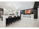 Open concept living space complete with kitchen, bar with art display and 6-seat island at 764 Ricota Ct, Henderson, NV 89012