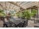 Outdoor dining and kitchen area with built in grill, table with seating and shade at 764 Ricota Ct, Henderson, NV 89012