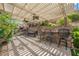 Outdoor dining and kitchen area with overhead trellis and built-in grill at 764 Ricota Ct, Henderson, NV 89012