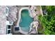Aerial view of a custom pool featuring a rock waterfall and lush landscaping at 764 Ricota Ct, Henderson, NV 89012