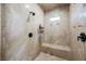 Walk-in shower showcasing marble-look tile and a built-in bench at 764 Ricota Ct, Henderson, NV 89012