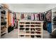 Organized walk-in closet boasts ample storage, shelving, and hanging space at 764 Ricota Ct, Henderson, NV 89012