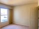 Bedroom featuring a bright window, closet door, and carpet flooring at 8000 Badura Ave # 2009, Las Vegas, NV 89113
