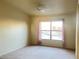 Cozy bedroom with carpet floors, ceiling fan and a window with curtains at 8000 Badura Ave # 2009, Las Vegas, NV 89113