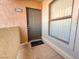 Apartment front door with a window, door number, and textured walls at 8000 Badura Ave # 2009, Las Vegas, NV 89113