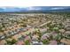 Aerial view showcases the property's location within a vast residential community with mountain views at 8253 Ruby Mountain Way, Las Vegas, NV 89128