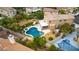 Aerial view of a home with an in-ground pool, spa, and a well-manicured backyard at 8253 Ruby Mountain Way, Las Vegas, NV 89128