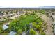 Aerial view of a green park and walking trails surrounded by neighborhood homes with a mountain backdrop at 8253 Ruby Mountain Way, Las Vegas, NV 89128