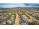 Expansive aerial view of the neighborhood, showcasing desert landscaping and a clear view of the Las Vegas Strip at 8253 Ruby Mountain Way, Las Vegas, NV 89128