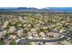 Located in a quiet neighborhood, aerial view of the home highlights the city and mountain views at 8253 Ruby Mountain Way, Las Vegas, NV 89128