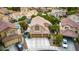 Two-story home with a tile roof, three-car garage, well-maintained landscaping, and a private pool in the backyard at 8253 Ruby Mountain Way, Las Vegas, NV 89128