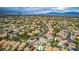 Wide aerial view of the neighborhood, emphasizing the lush greenery and various backyard pools throughout the community at 8253 Ruby Mountain Way, Las Vegas, NV 89128